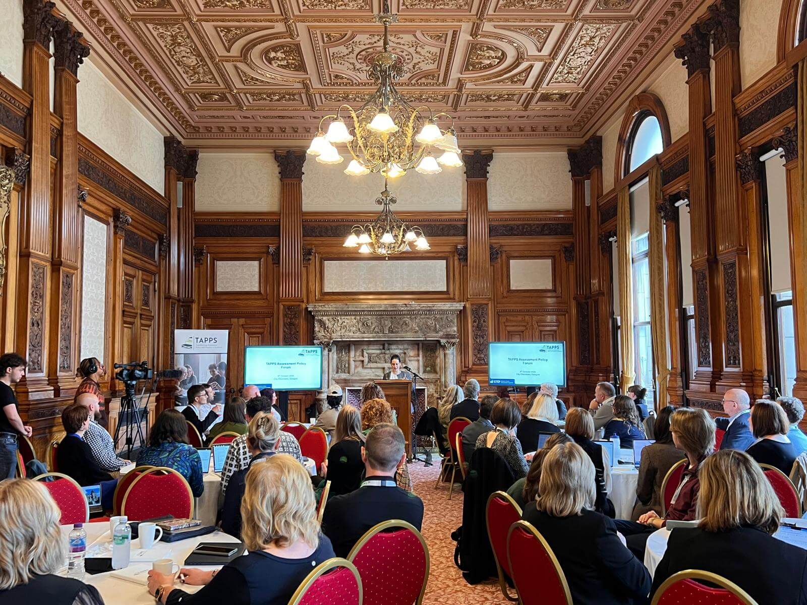 People gathered in a plenary session