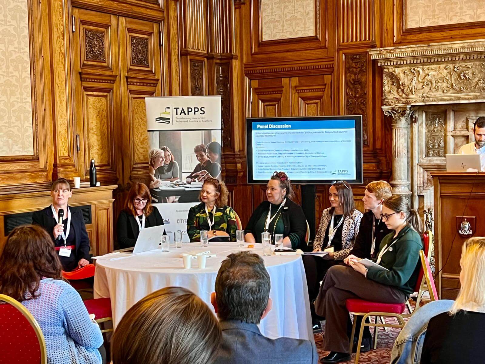 Six people participating in a panel discussion